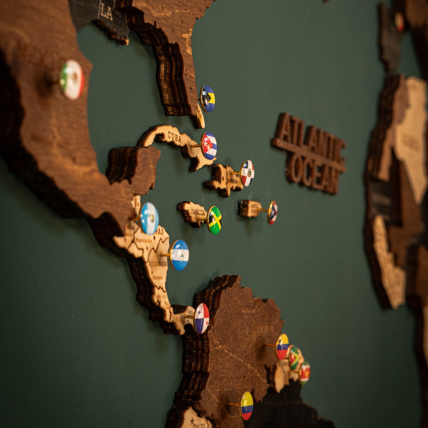 Laser-cut wooden map in black, brown, and beige layers
