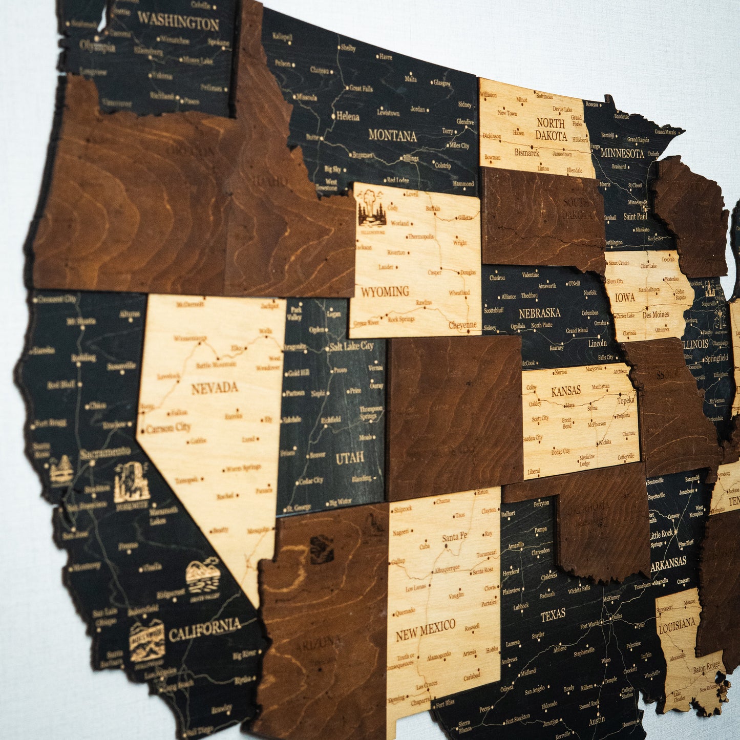Map of the United States made from wooden states on a light blue background