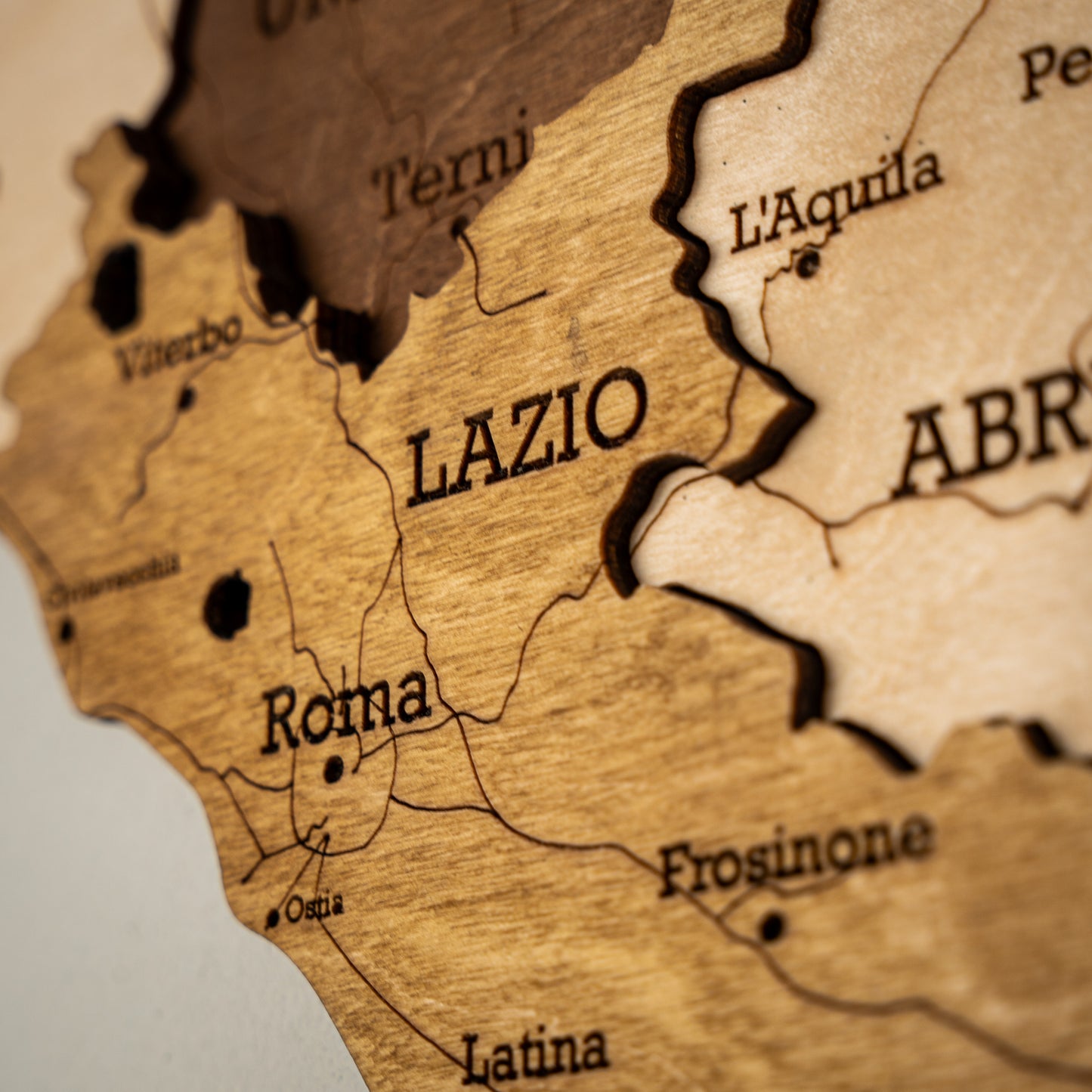 Minimalist black and beige wooden Italy map with Lazio highlighted