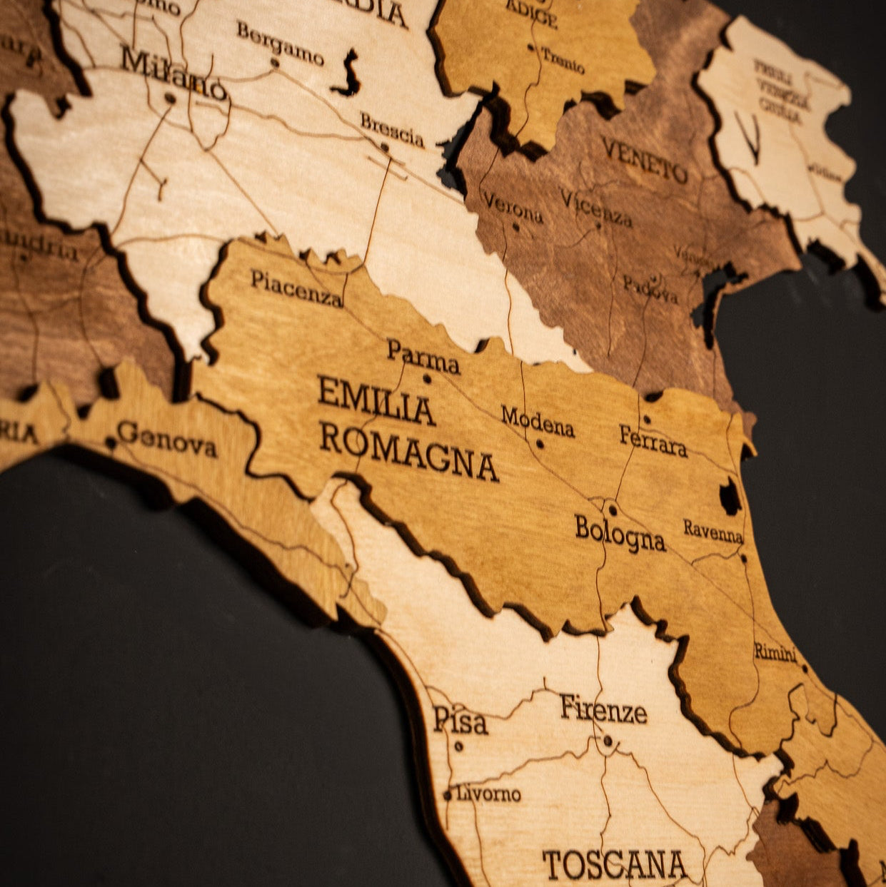Precision engraved Italy wooden wall map in earth-tone layers with Emilia Romagna in foucs close up