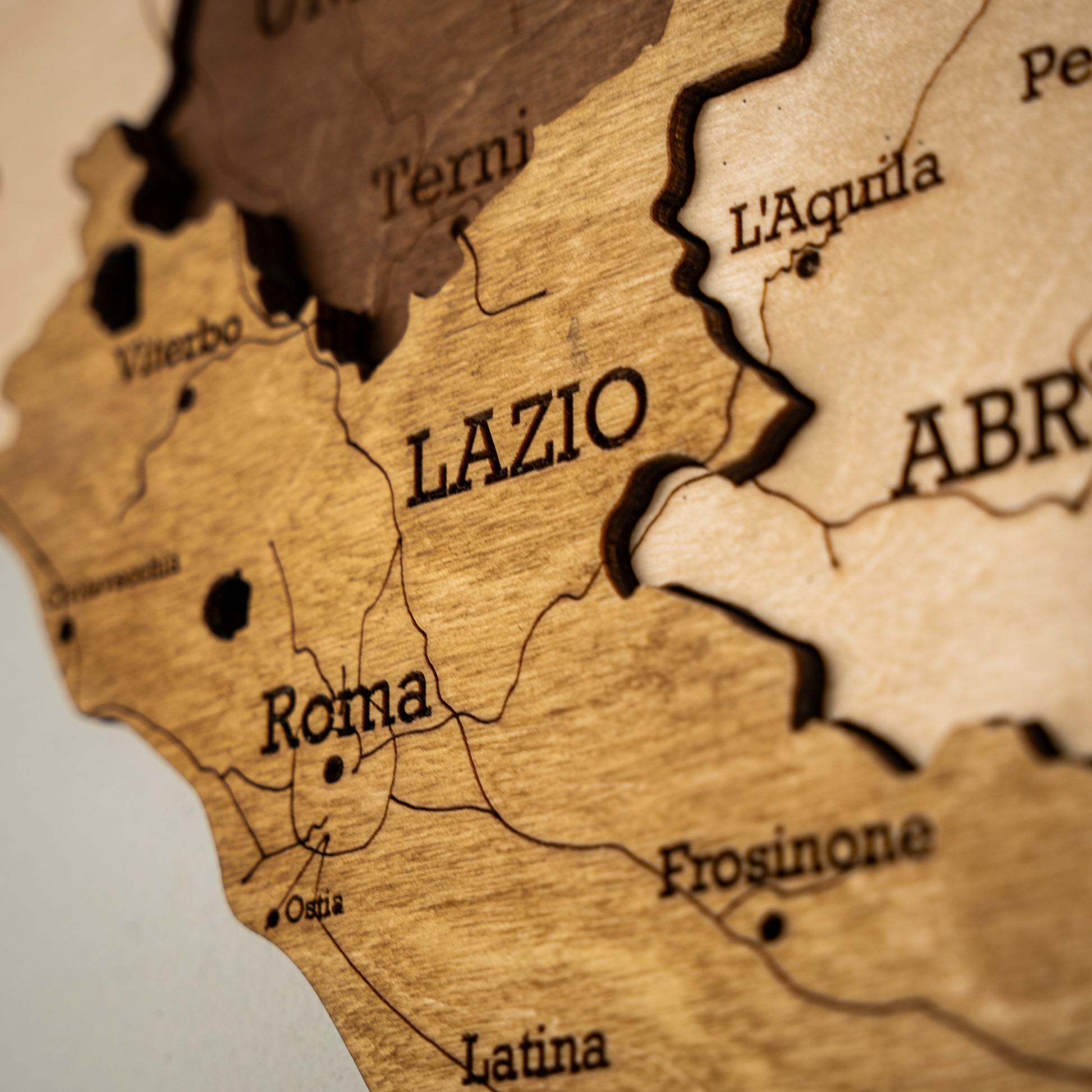 Minimalist black and beige wooden Italy map with Lazio highlighted